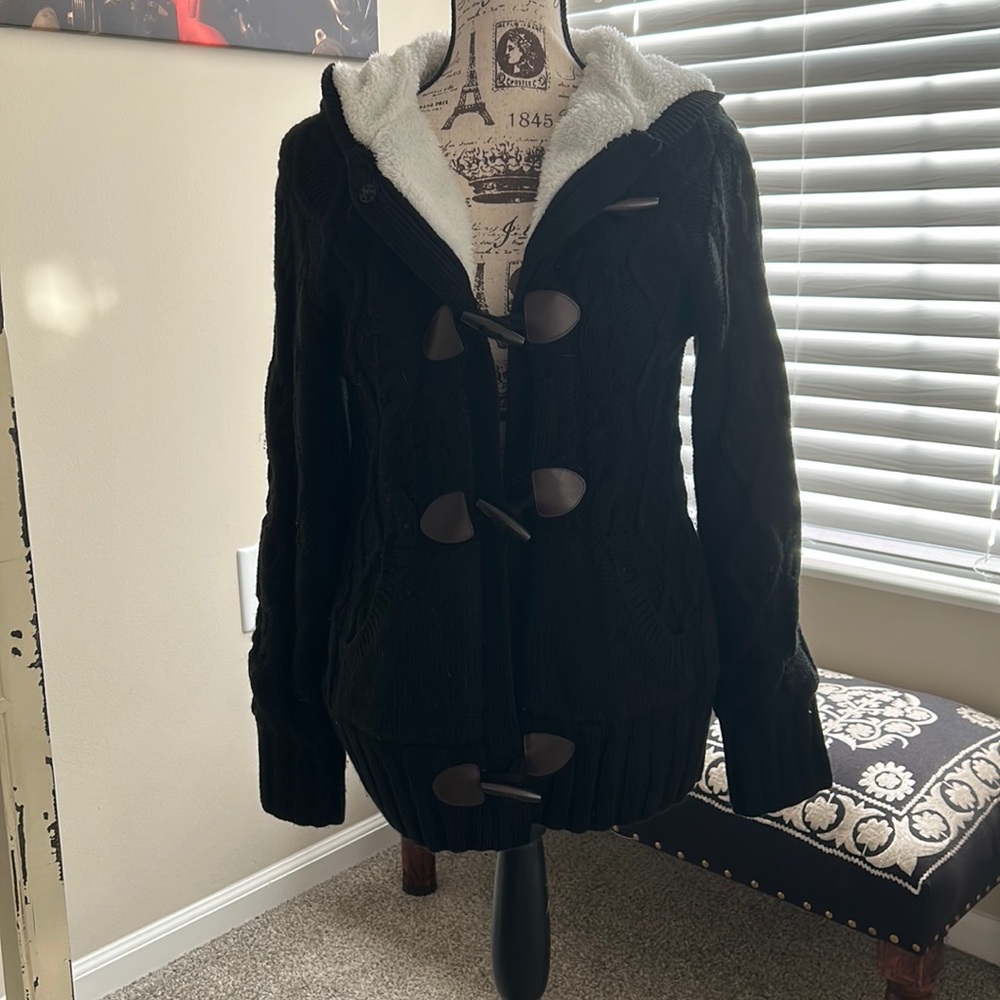 Very warm black and white fur lined sweater jacket.